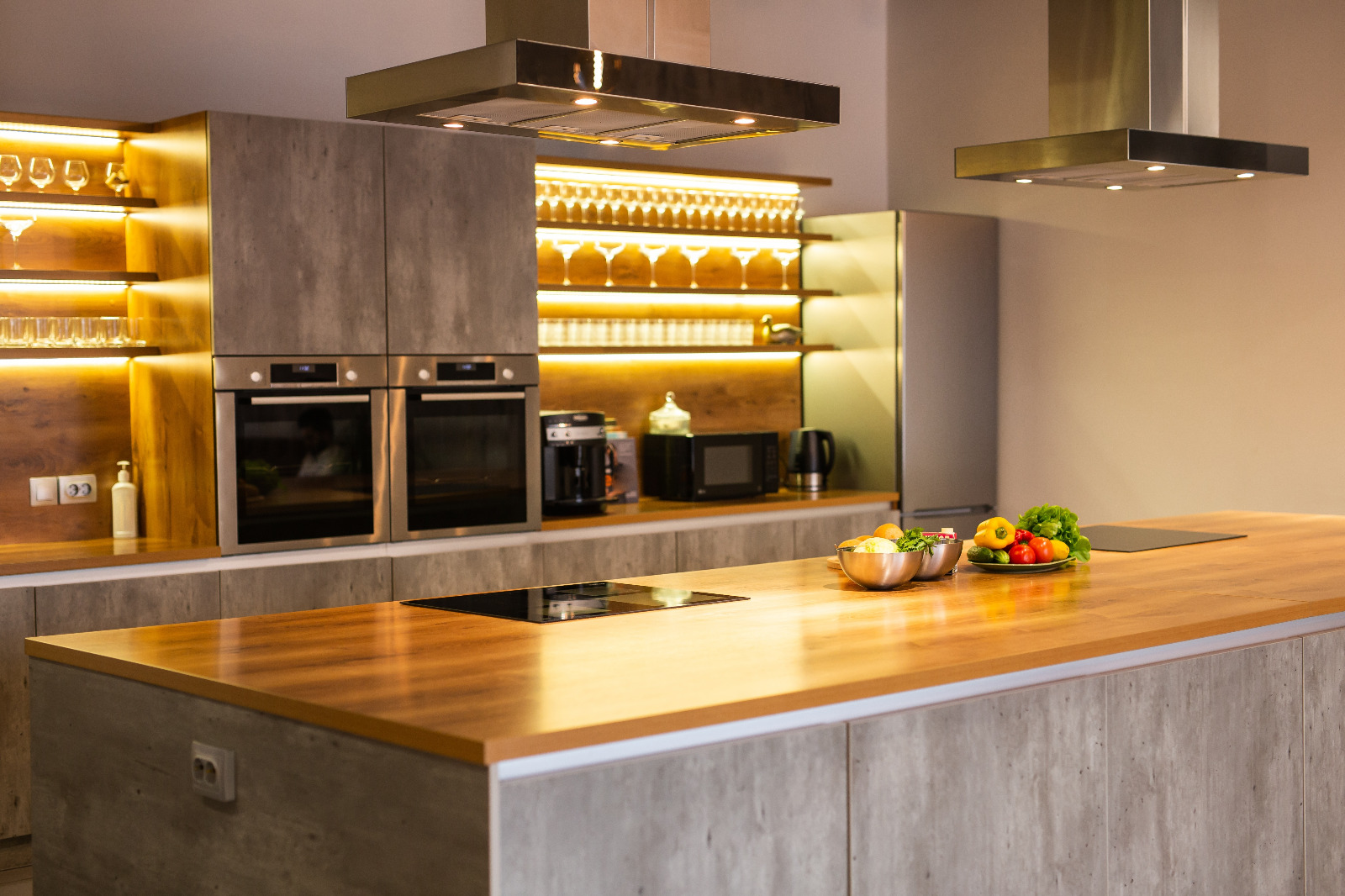 Worktop Refinishing in a modern kitchen with sleek oak wooden worktops and matching engineered oak wood floor, showing a smooth, glossy finish after restoration.